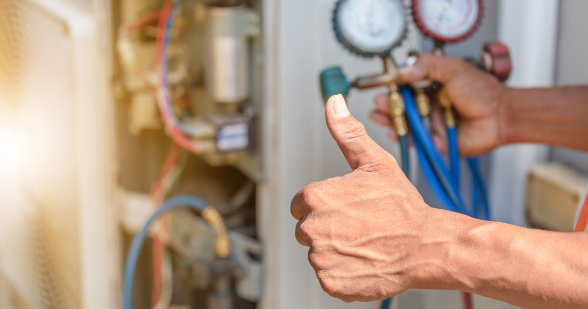 HVAC technician making thumbs up