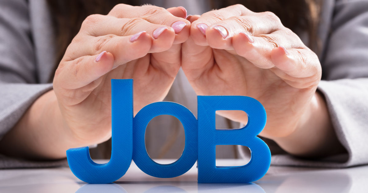 man cupping hands over job text