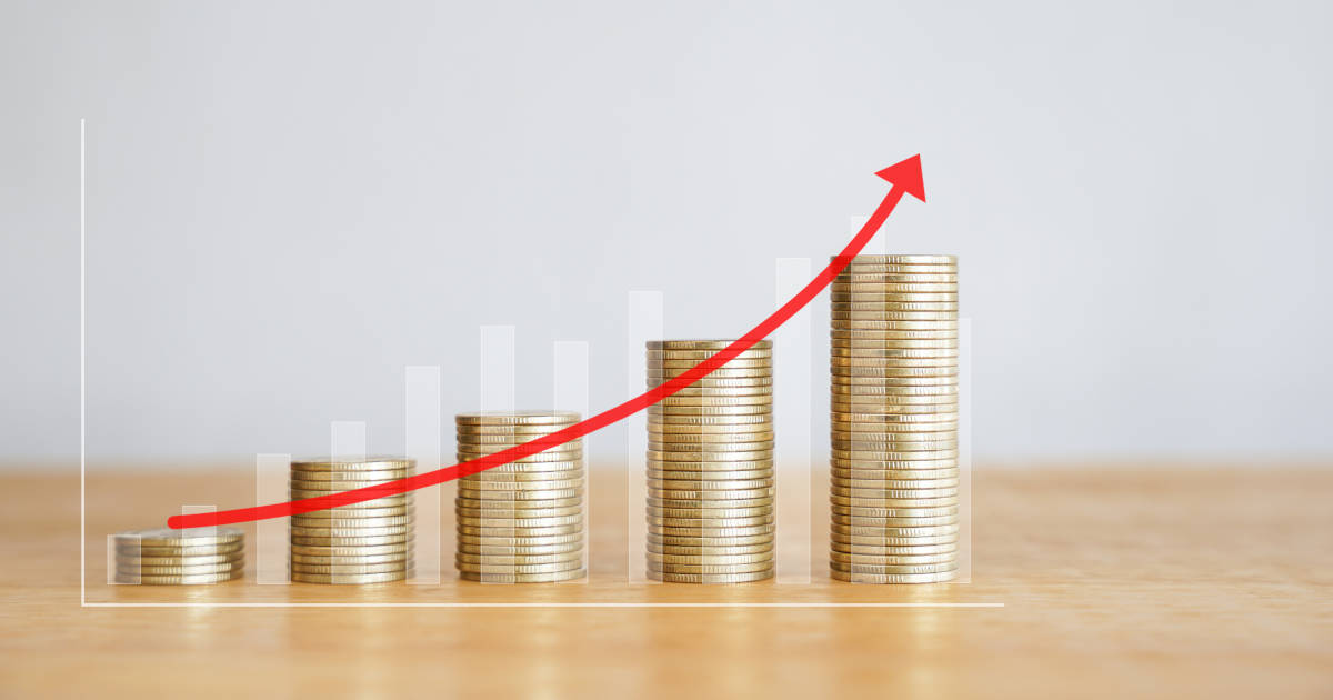 upward arrow above coin stacks